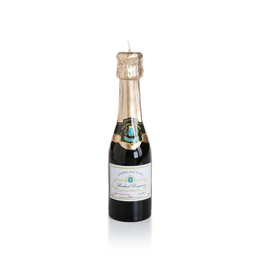 Bottle-shaped candle with a label on a white background