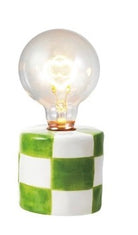 Table lamp with a checkered base and clear bulb on a white background