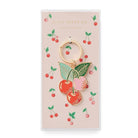 Cherry-themed keychain on a decorative card with 'Apple Paper Co.' branding.