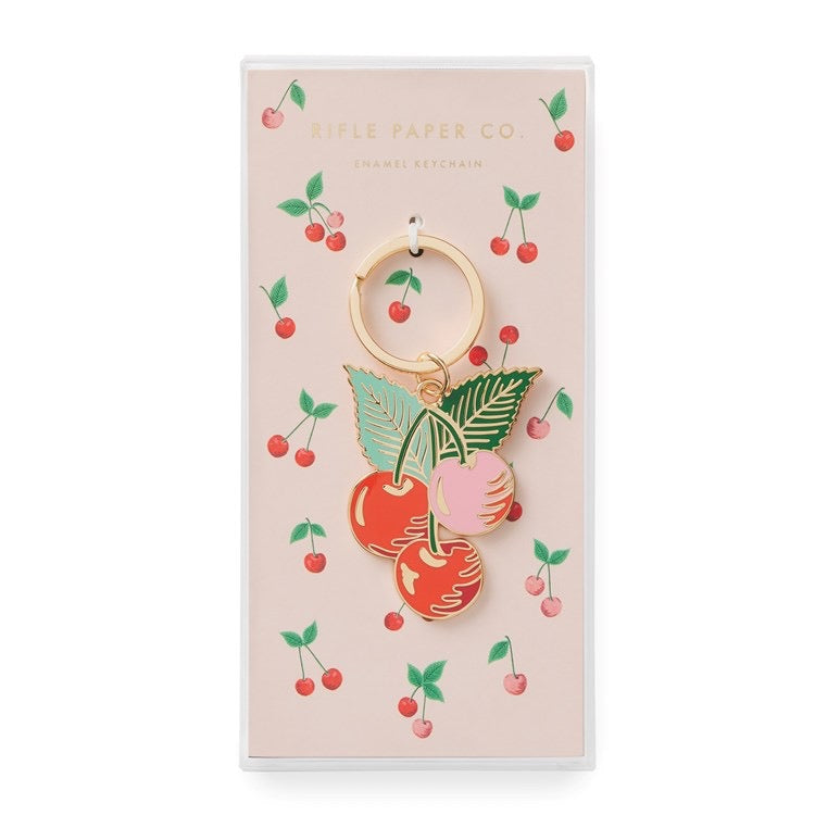 Cherry-themed keychain on a decorative card with 'Apple Paper Co.' branding.