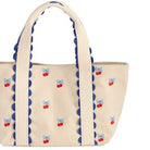 Beige tote bag with blue scalloped edge and cherry and bow pattern on a white background