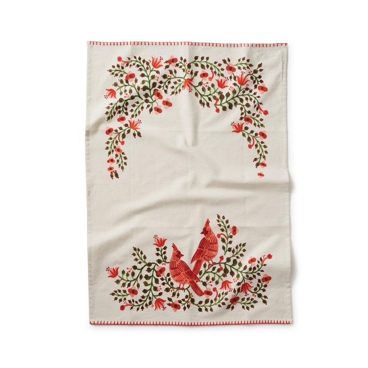 Embroidered towel with red cardinals and floral patterns on a white background