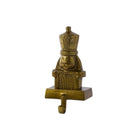 A small decorative nutcracker-shaped wall hook in a metallic antique gold/bronze finish, shown against a plain white background.