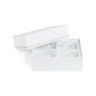 White lace bralette in a box on a white background