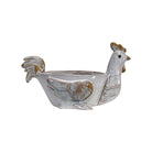 Ceramic chicken-shaped planter on a white background