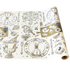 Roll of decorative paper with black and gold food-themed illustrations on a white background