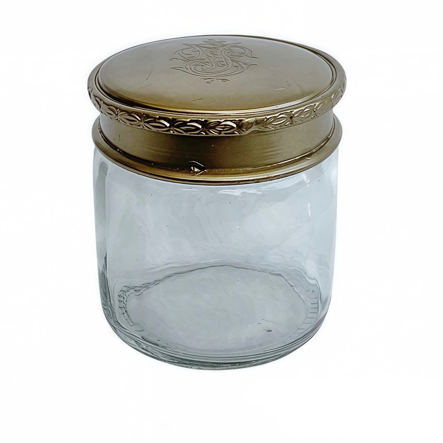 Clear glass jar with a gold lid on a white background