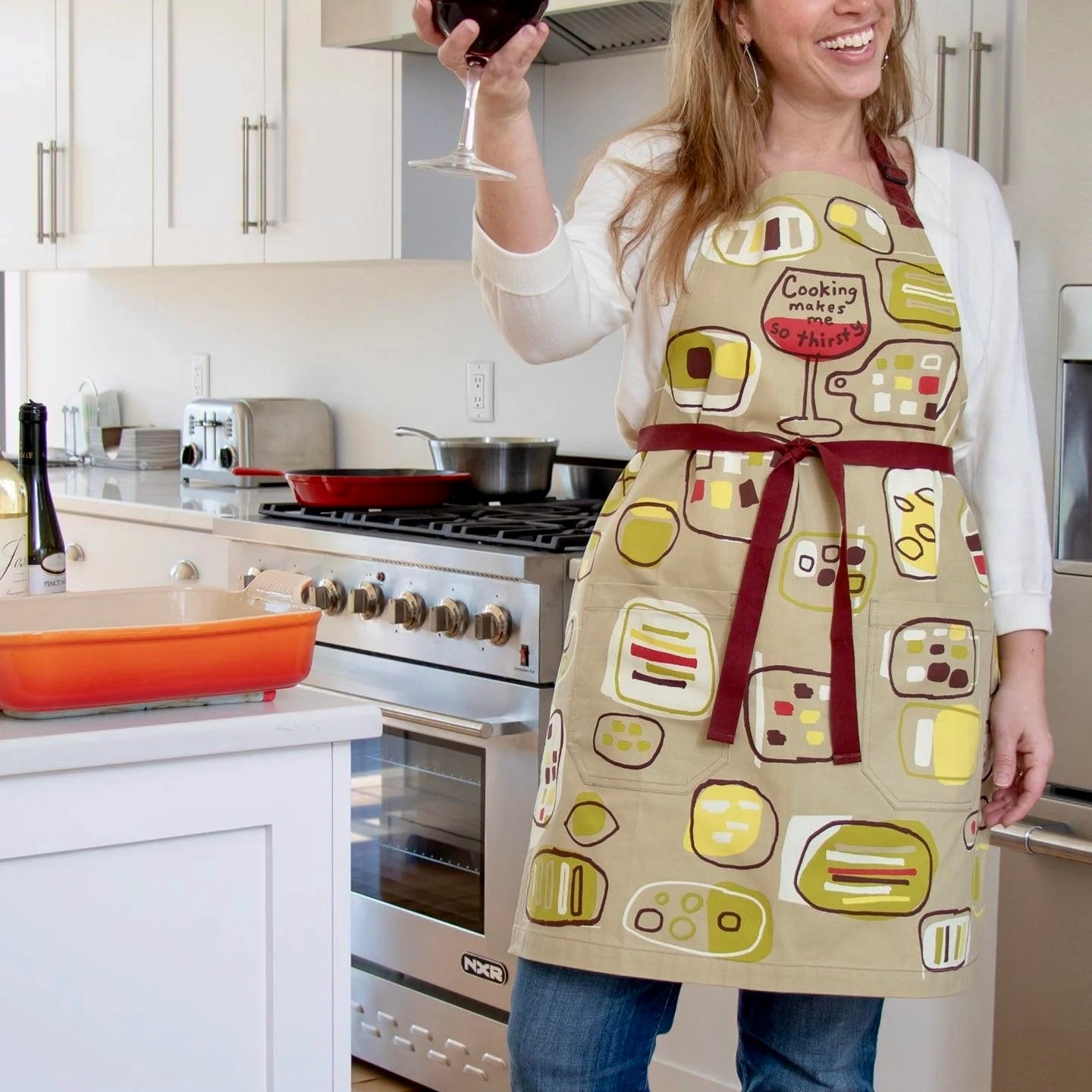 Person wearing a colorful apron in a kitchen