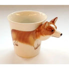 Ceramic mug shaped like a corgi on a white background
