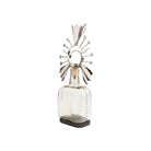 Decorative glass bottle with metallic top on a white background