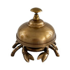 A brass lobster-shaped bellhop or waiter's station with a domed top and clawed base, shown on a plain white background.