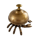 A brass lobster-shaped bellhop or waiter ornament with a domed lid and clawed base, shown on a plain white background.