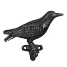 Black cast iron bird-shaped door knocker on a white background