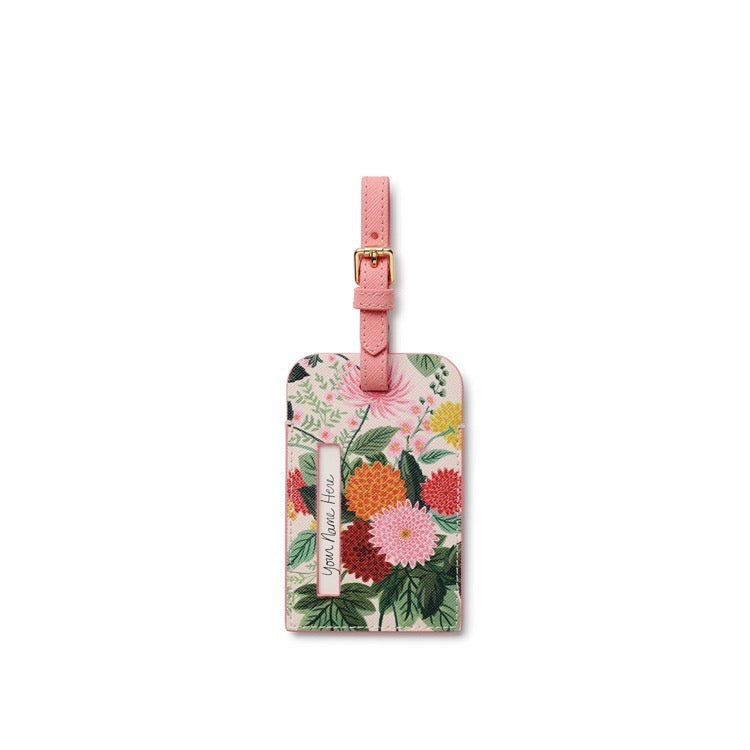 Floral luggage tag with pink strap on a white background