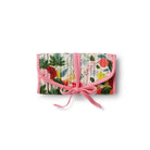 Floral-patterned clutch with a pink bow on a white background