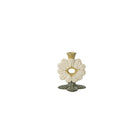 Decorative candle holder with floral design on a white background