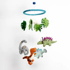 Children's dinosaur mobile with hanging leaves on a white background