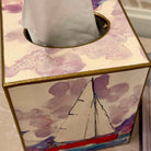 Tissue box cover with sailboat design on a floral background