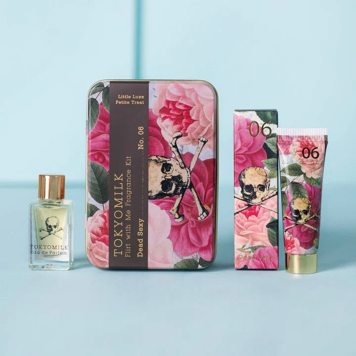 Skull-themed beauty products with floral design on a light blue background