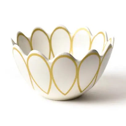 White ceramic bowl with gold leaf patterns on a white background