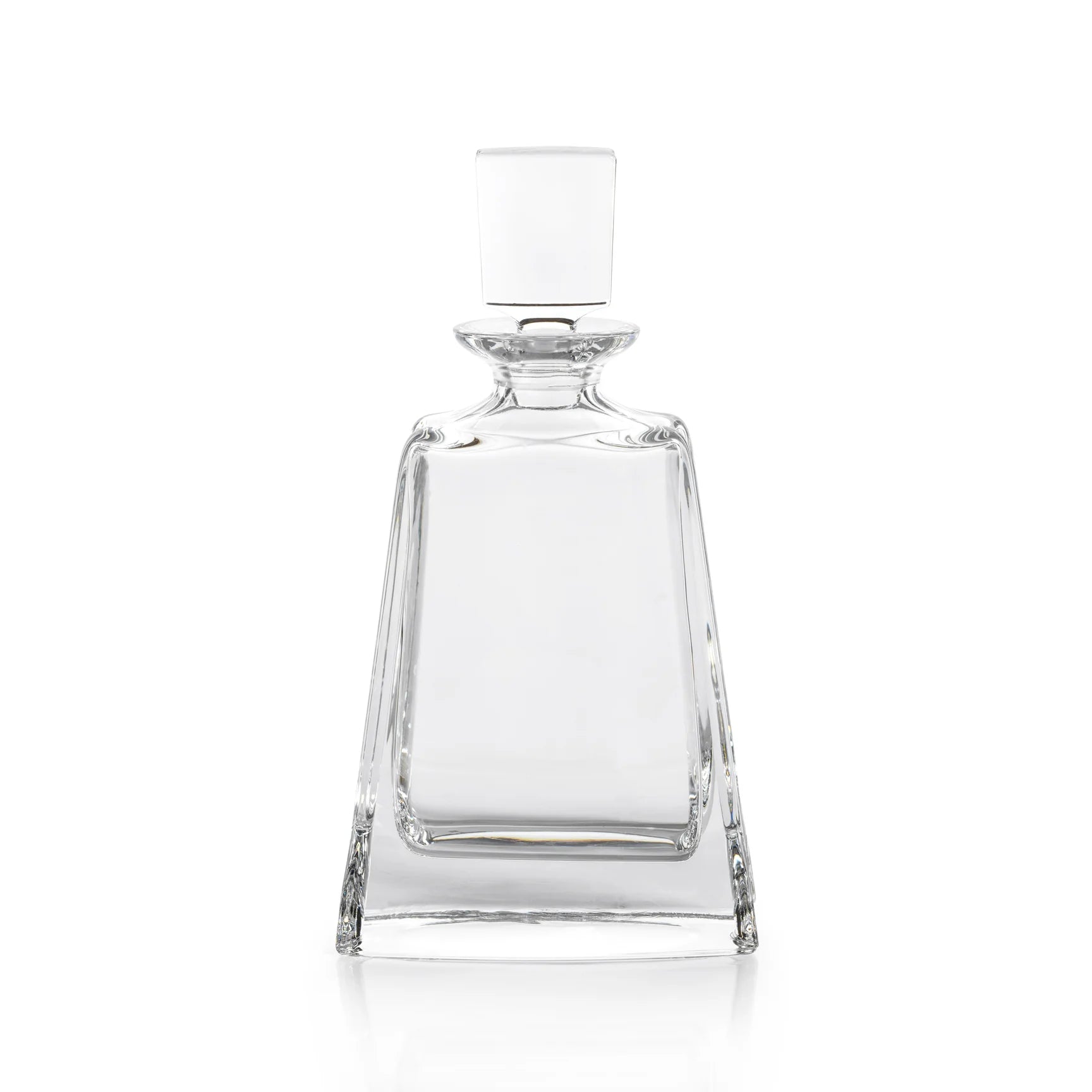A clear crystal decanter with a rounded body and a bulbous mid-section, featuring a small protruding stopper.