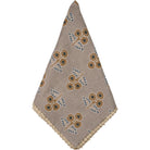 Decorative napkin with floral pattern on a beige background