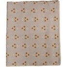 Patterned fabric with floral design on a beige background
