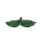 Decorative ceramic leaf-shaped dish with a bird on a white background
