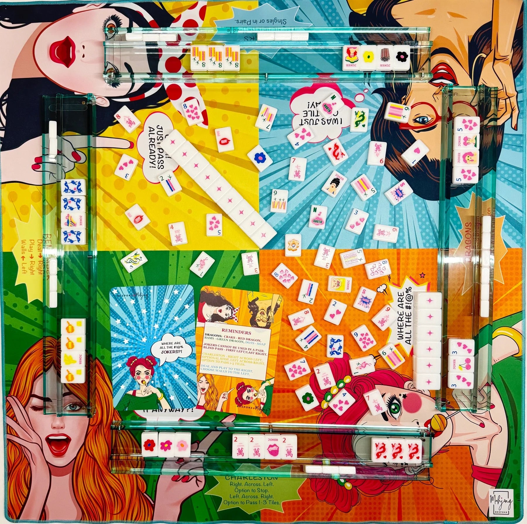 A square acrylic gaming board with a vibrant pop-art comic illustration featuring multiple illustrated women, playing cards scattered across the surface, and a clear acrylic game piece frame. The background is a matching colorful pop-art comic print.