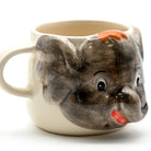 Mug shaped like a fish with a smiling face on a white background