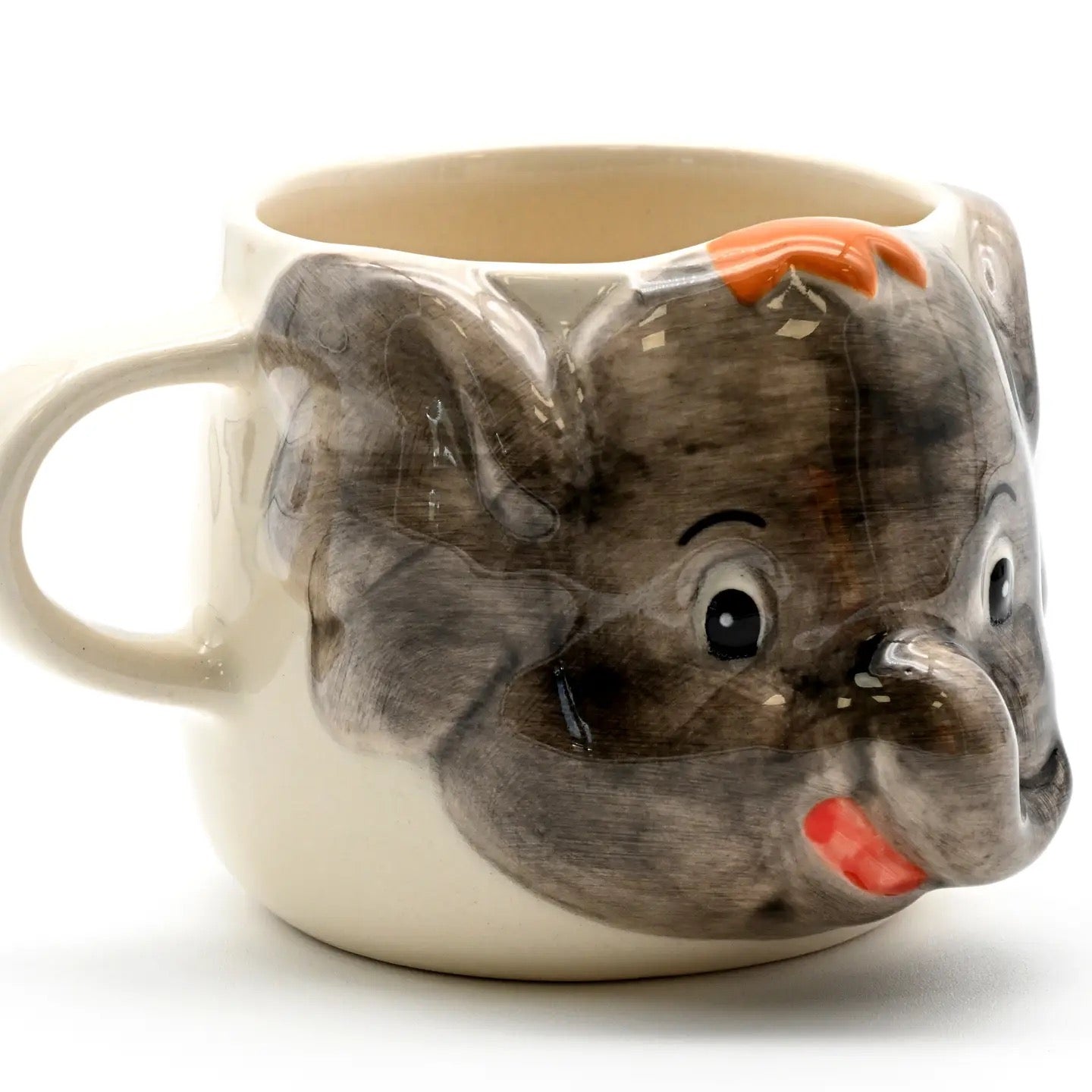 Mug shaped like a fish with a smiling face on a white background