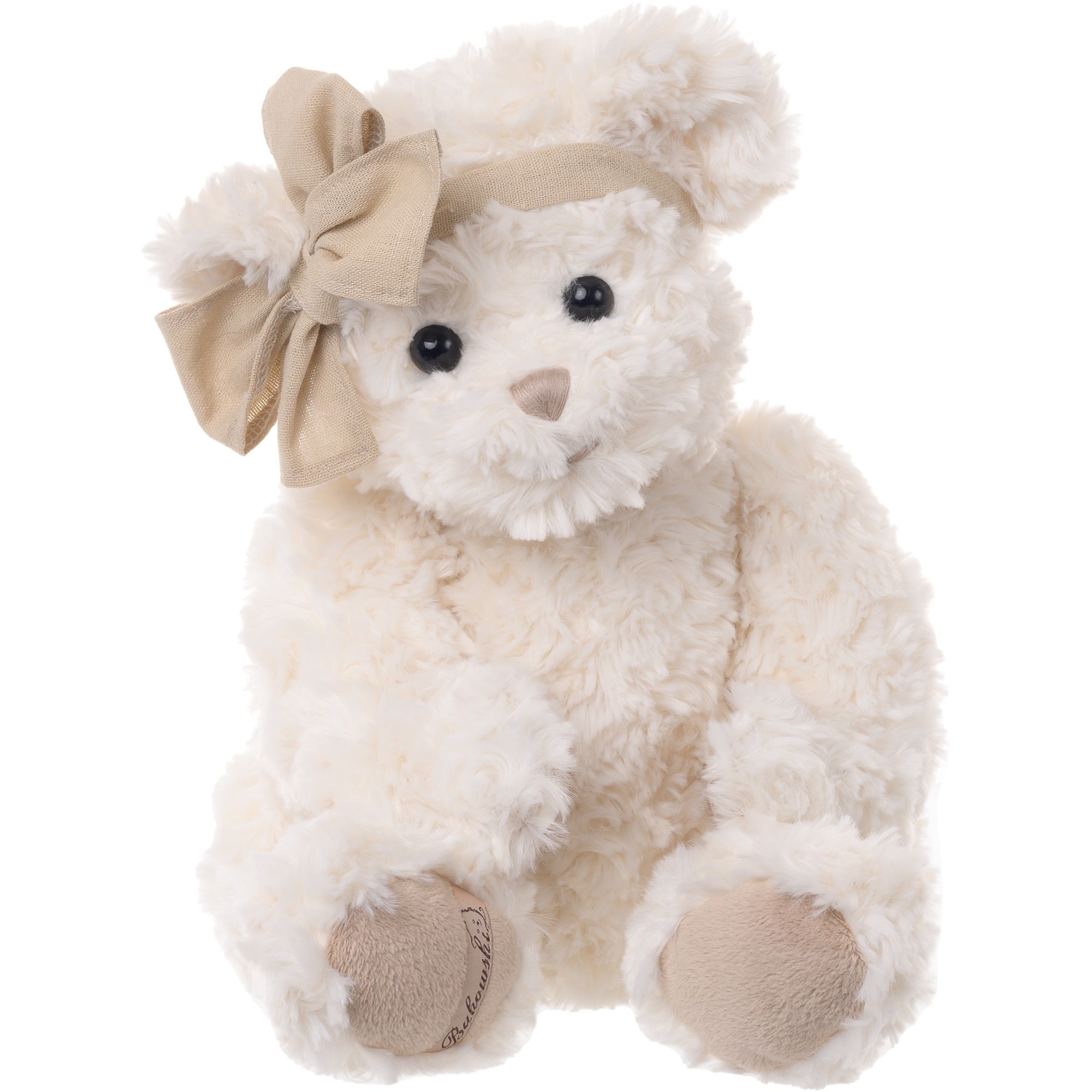 Plush teddy bear with a beige bow on a white background