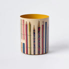 Cylindrical container with a pattern of colored pencils on a white background
