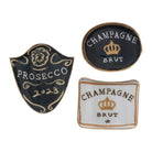 Three decorative plates with 'Prosecco 2023' and 'Champagne Brut' designs on a white background.