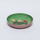 Decorative plate with floral design on a white background