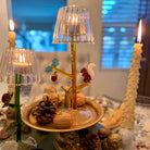 Decorative candle holders with candles on a table