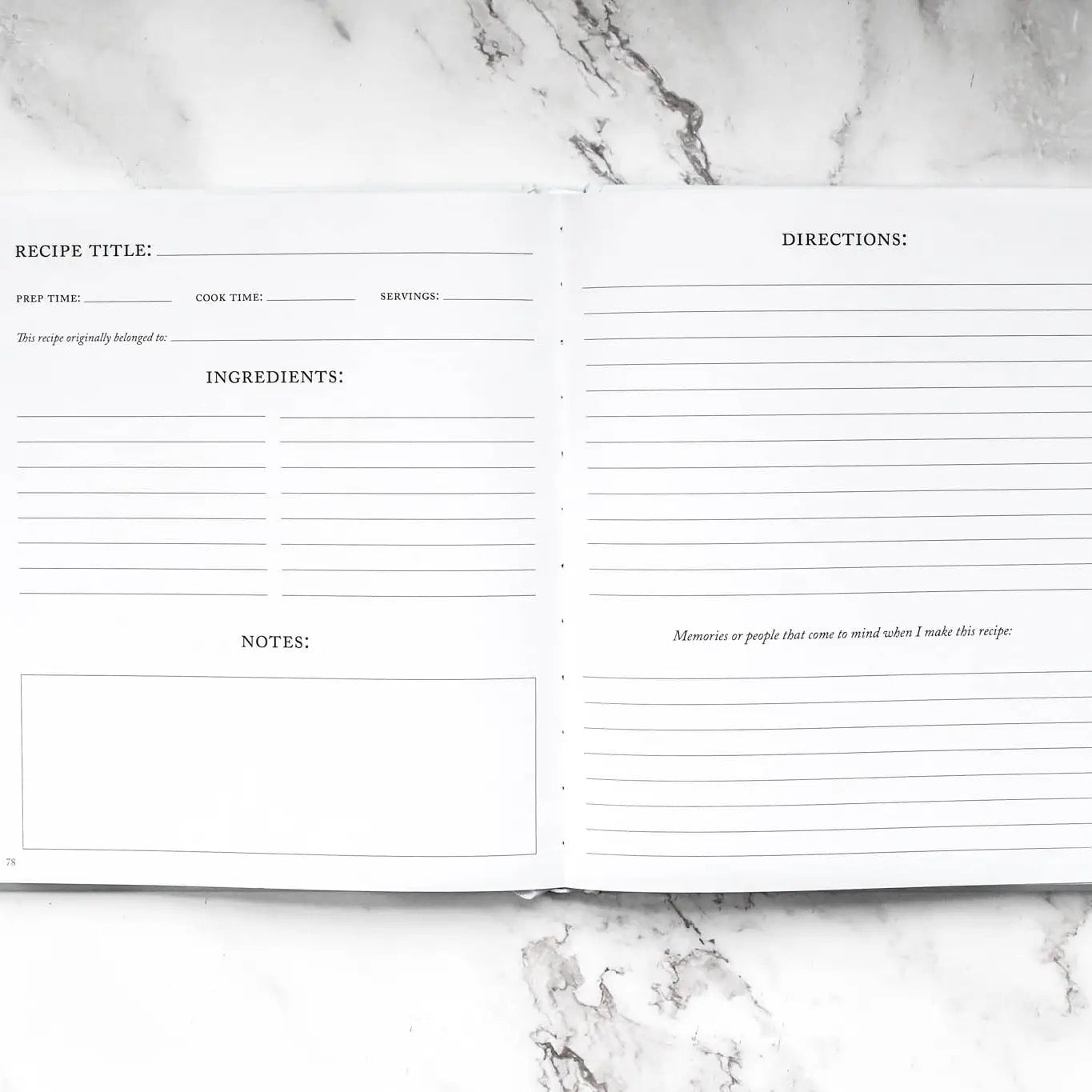 Blank recipe card with sections for title, time, ingredients, directions, and notes on a marble surface.