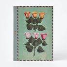 Notebook with floral design on a green background