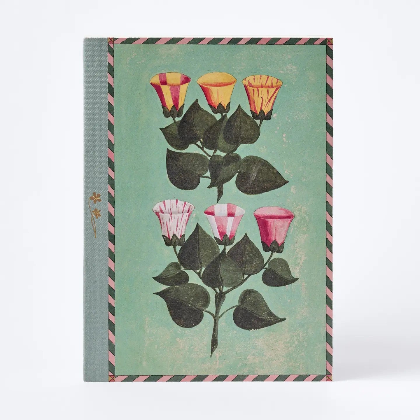 Notebook with floral design on a green background