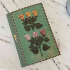 Notebook with floral design on a marble surface