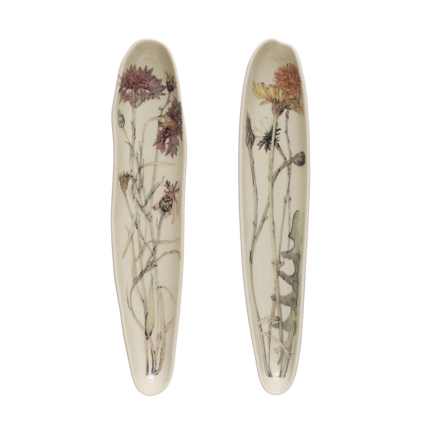 Two ceramic plates with floral designs on a white background