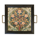 Decorative tray with floral design and brass handles on a white background