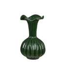 Green vase with ribbed design on a white background