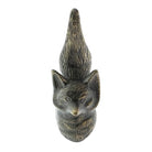 A small carved cat figurine with a textured, weathered finish in dark brown and gray tones, shown against a plain white background.