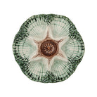 Decorative plate with a star design on a white background