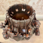 Metallic bracelet with star-shaped clasps on a neutral background