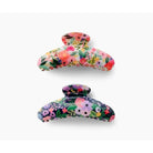 Two floral-patterned hair clips on a white background
