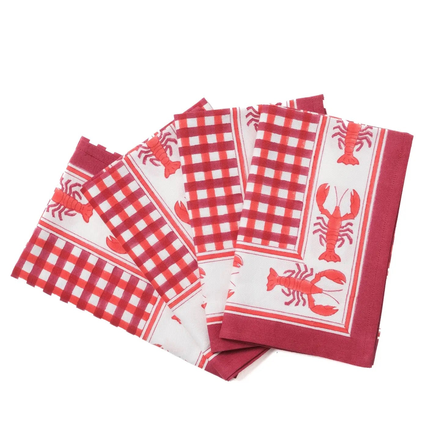 Set of red and white checkered napkins with lobster designs on a white background