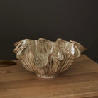 Ceramic bowl with textured surface on a wooden surface
