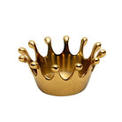 A small metallic gold crown-shaped candle holder or decorative container with a glossy finish, shown against a plain white background.